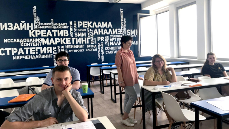 Students in a classroom learning to speak Russian