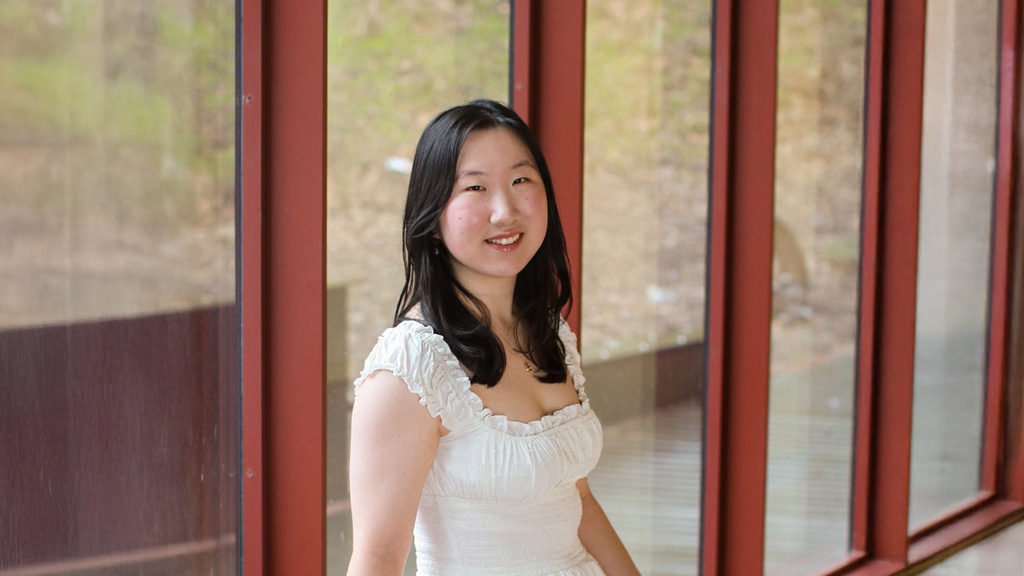 Brenda Gao stands in front of multiple windows